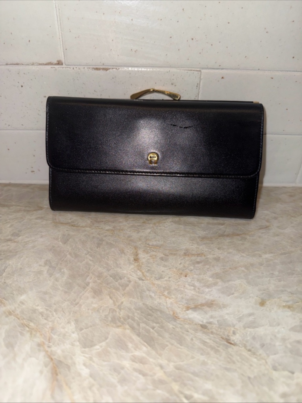 Black soft leather tri fold Etienne Aigner Wallet